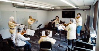 Adult-musicians-playing-circle-strings. Image from OCM