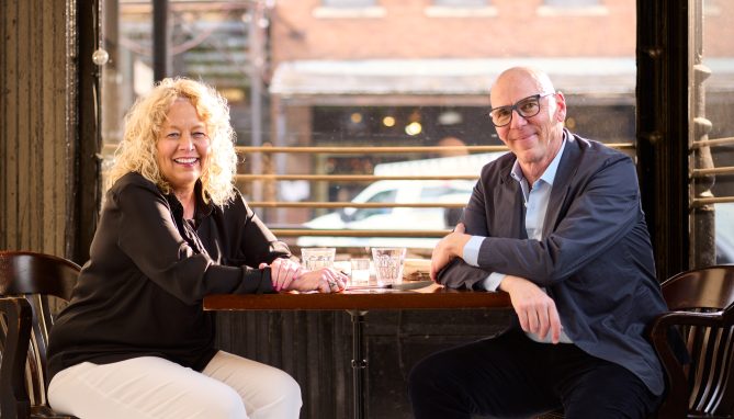 Close up of Jeff and Diane at a table in a restaurant