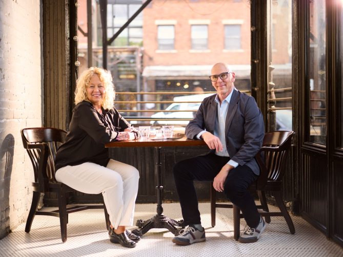 Jeff and Diane at a table at a restaurant