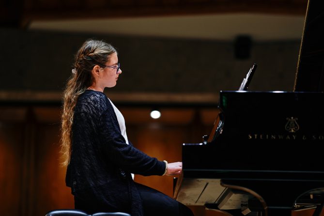 Cate Frazier playing the piano
