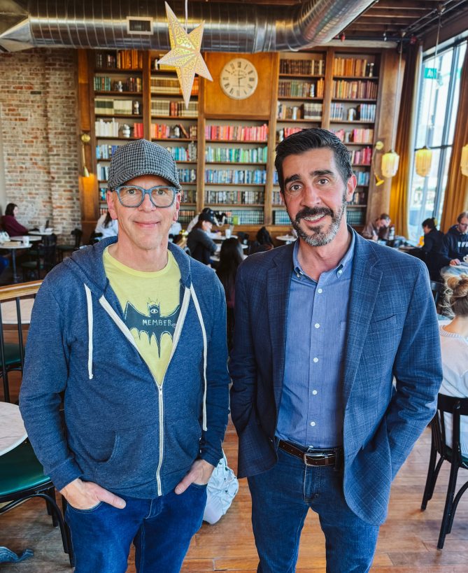 Jeff Koterba and Jeff Slobotski posed together, with hands in pockets, at The Mill. 