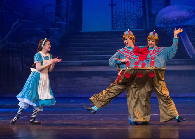 Erin Alarcón as Alice in Wonderland, who encounters the quarrelsome Tweedle Dee and Tweedle Dum in American Midwest Ballet's production of Kennet Oberly's 