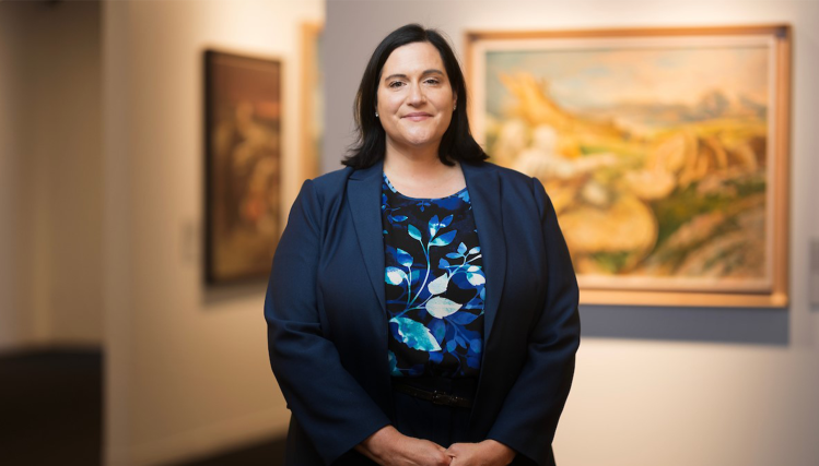 Hillary Nather-Detisch, Executive Director of the Samuel Bak Museum: The Learning Center, smiles while posing for a professional portrait.
