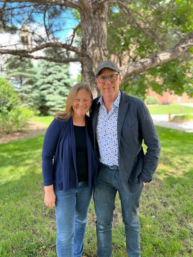 Jeff Koterba and Becky Lowe standing together under a tree. 