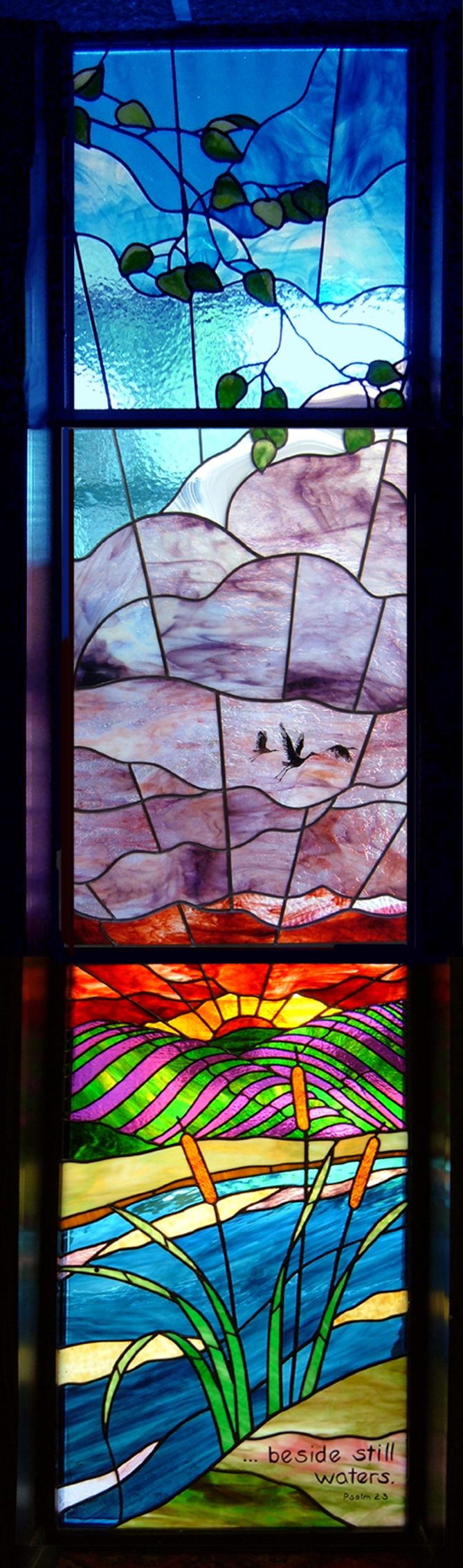 A stained-glass window called Sunset created by Julee Lowe