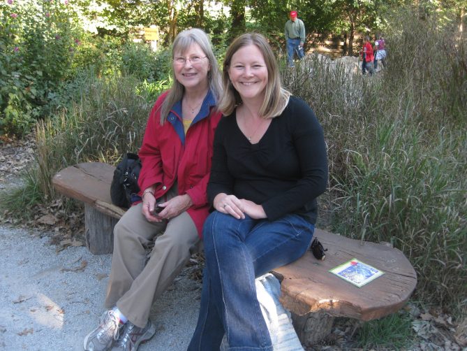 Julee and Becky Lowe sitting on a bench