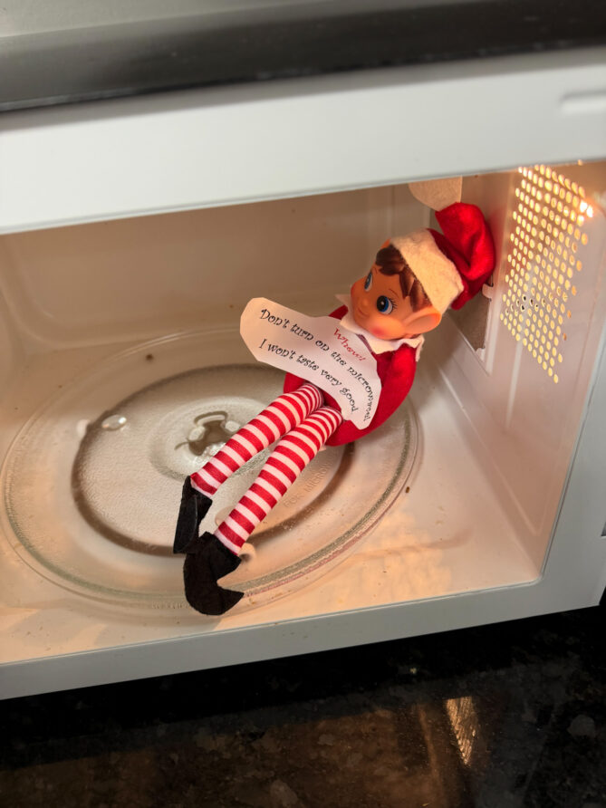 Ivanhoe, the elf on the shelf, found in the Microwave with a new that says: Whew! Don't turn on the microwave! I won't taste very good.