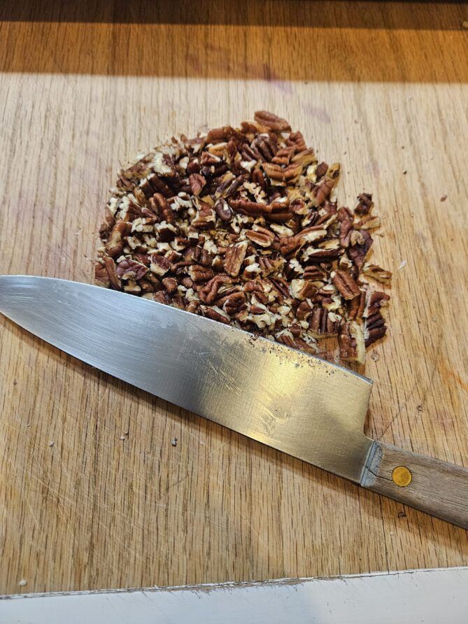 Chopped pecans with knife