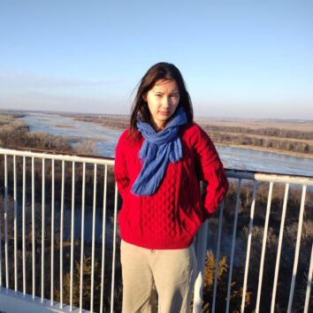 Classical Kid, Aisling Day, standing on a bridge.