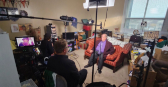 Local filmmaker David Weiss stands with Dean, known as the Rose Man, during a wide shot from the filming of the documentary The Rose Man of Omaha. TitleLocal filmmaker David Weiss stands with Dean, known as the Rose Man, during a wide shot from the filming of the documentary The Rose Man of Omaha.