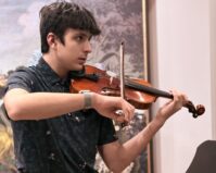 Kyler Lakeman playing the violin.