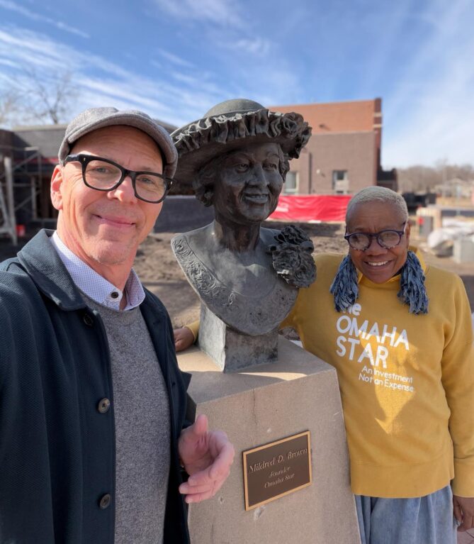 Jeff Koterba with Terri D. Sanders next to the Mildred D. Brown statue. 