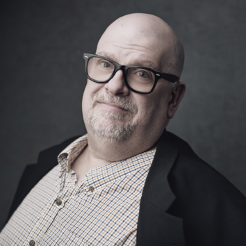 Headshot of KVNO's Operations Manager, Brian Davis.