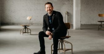Executive Director Chris Cook posing for a portrait.