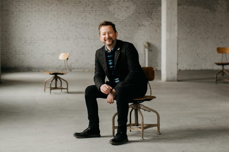Executive Director Chris Cook posing for a portrait.
