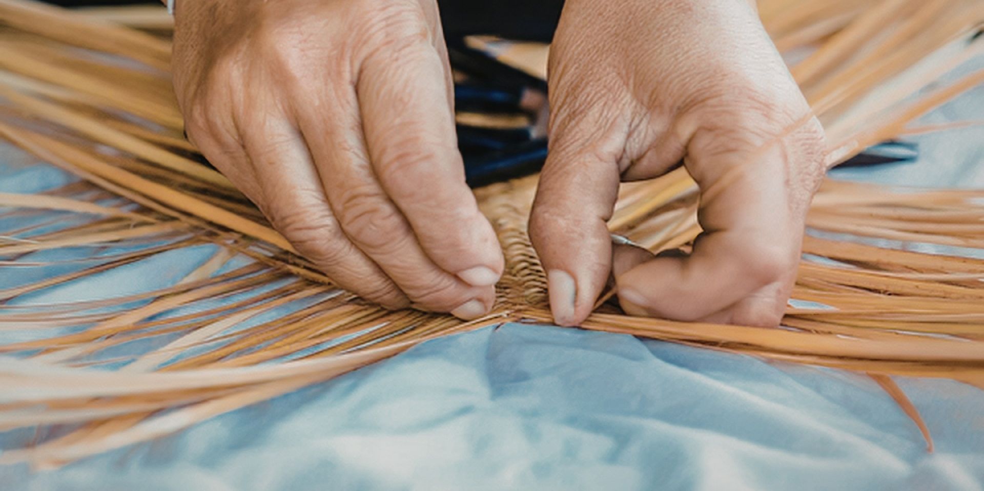 A picture of hands sewing fabric