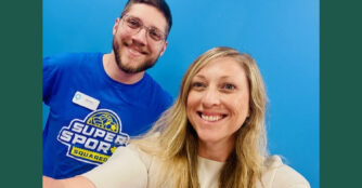 Erin Foley, Interim CEO & CFO, and Ben Ross, Director of Education and Guest Experience, standing together in a professional setting, facing the camera with neutral, approachable expressions.