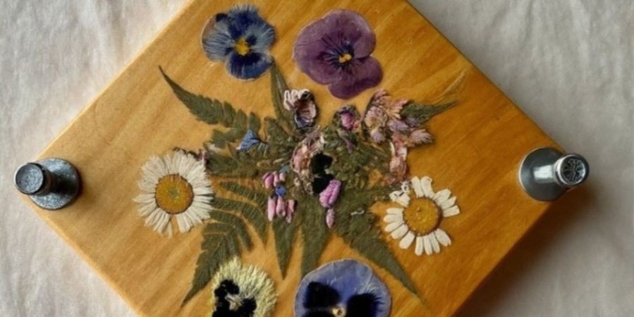 Pressed flowers on a wooden board