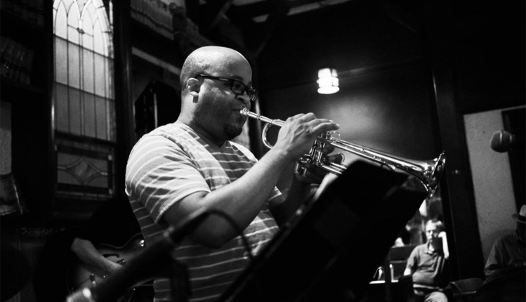 Doyle Tipler plays the trumpet in a black-and-white photo provided by Tipler.